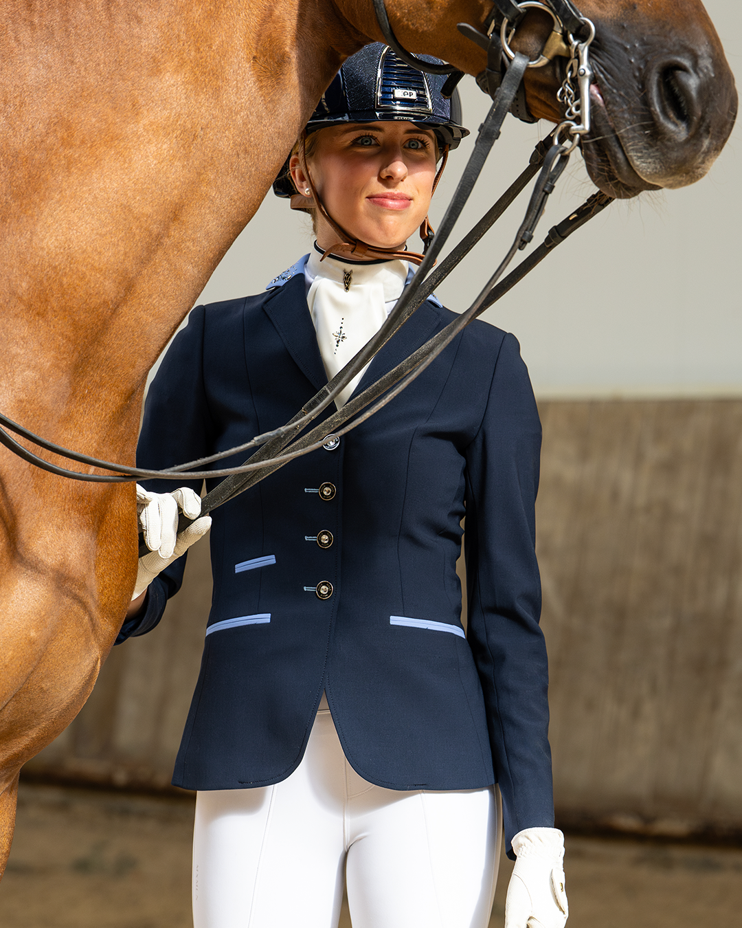 Front of JuulC Women's show coat in Navy Light Blue with contrasting accents on the collar and pockets, worn by model
